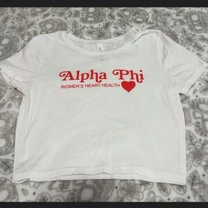 White Alpha Phi t-shirt w/ “Alpha Phi WOMEN’S HEART HEALTH” in red & a red heart